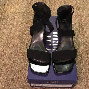 Stuart Weitzman black elastic sandals.